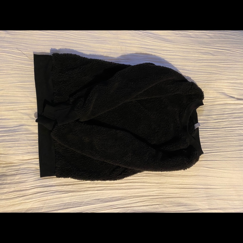 I am selling this fuzzy black sweater.